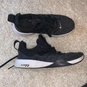 Black Nike tennis shoes